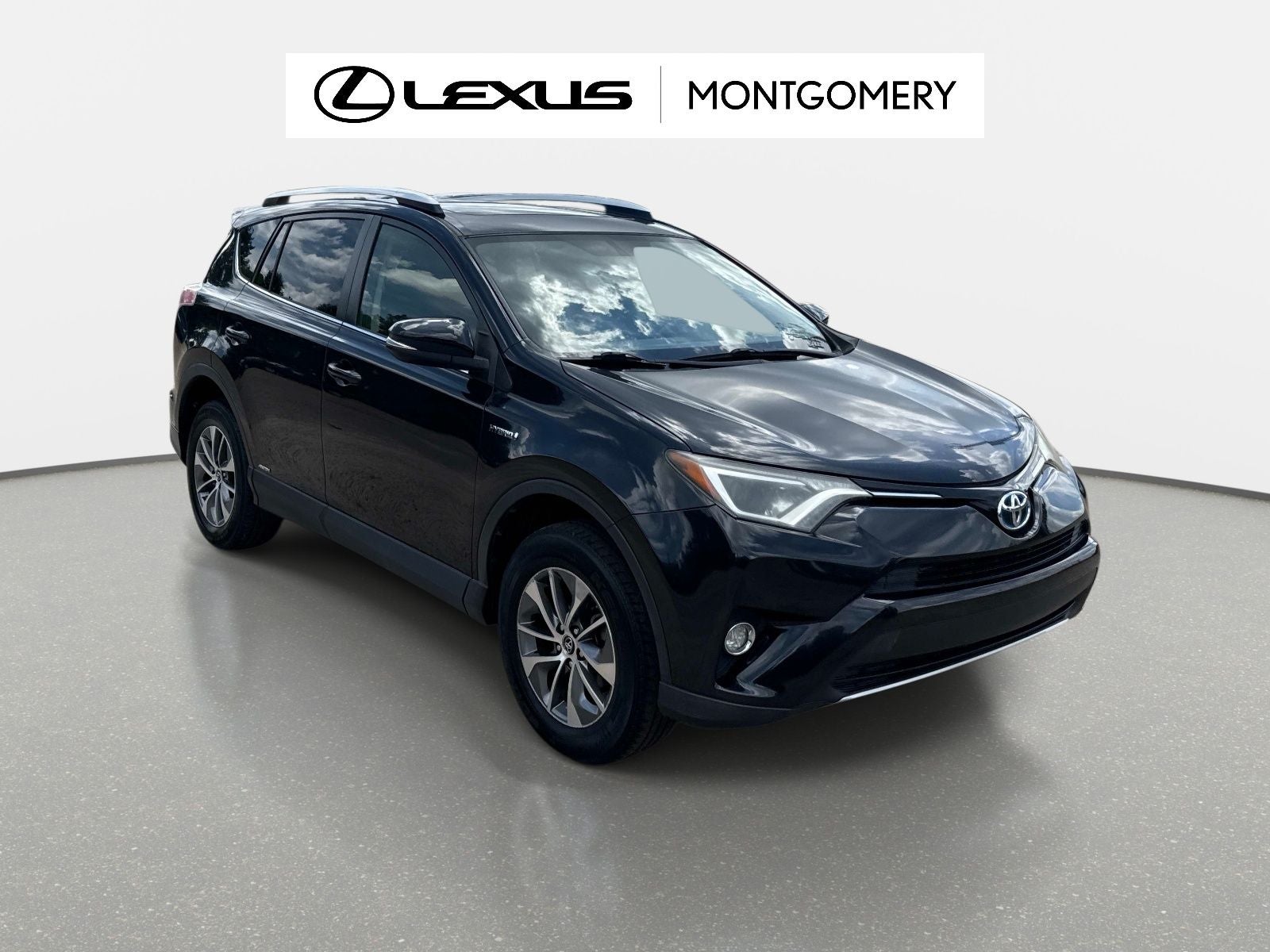 2016 Toyota RAV4 Hybrid XLE in Black Sand Pearl — front three-quarter view